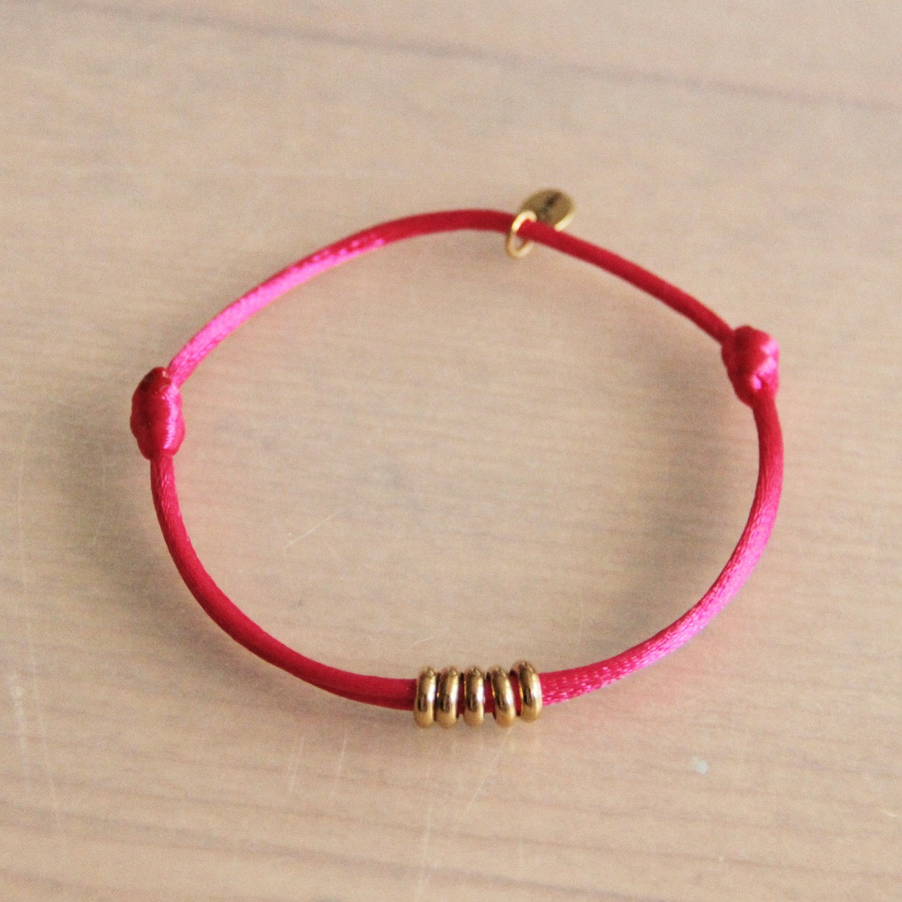 Bazou | Satijn armbandje met ringen